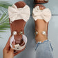 Elegante Sandalen mit Knöchelriemen und Perlen.